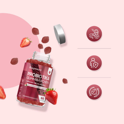 Probiotika-Gummibärchen im Glas mit Schraubdeckel, daneben Erdbeeren und Gummies